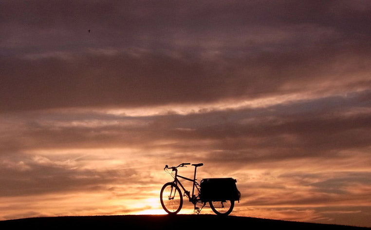 An Xtracycle on a hill at sunset